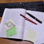 open notebook lying on keyboard
